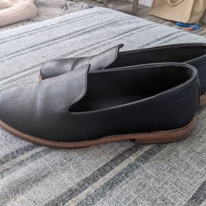 Black leather flats